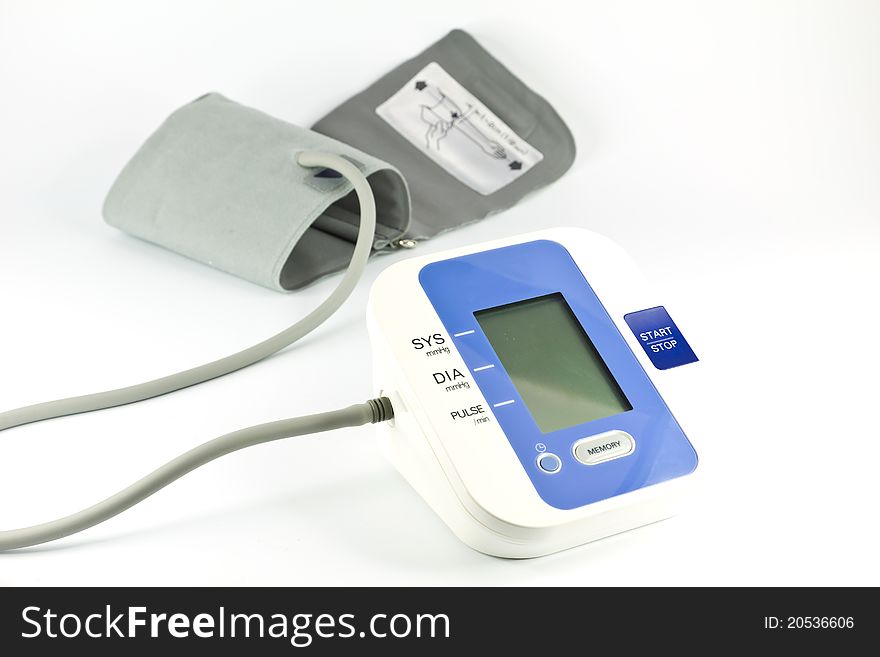 Digital blood pressure monitor over white