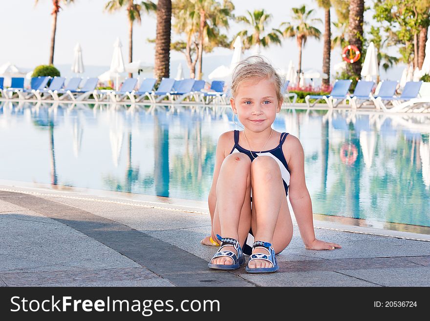 Beautiful girl posing at the swimming pool. Beautiful girl posing at the swimming pool