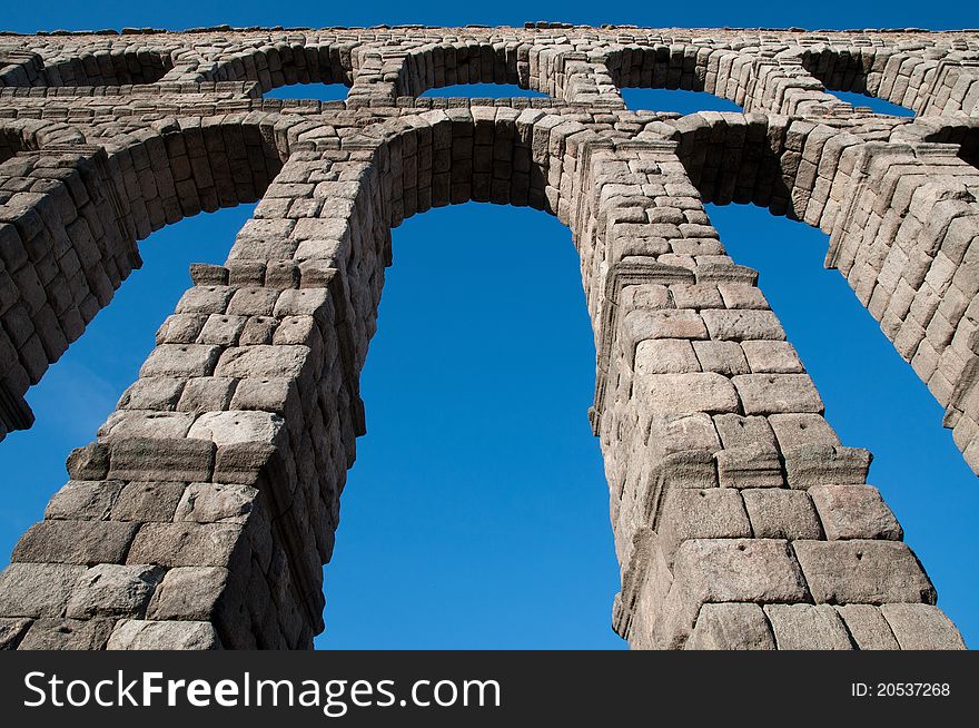 Below view of Roman aqueduct of Segovia, Spain.