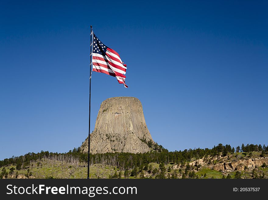 An American flag waves near the entrance to Devils Tower park in Wyoming. An American flag waves near the entrance to Devils Tower park in Wyoming.