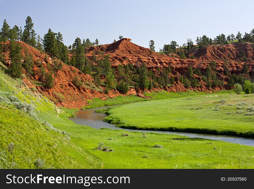 A small river runs through a colorful valley in Wyoming. A small river runs through a colorful valley in Wyoming.