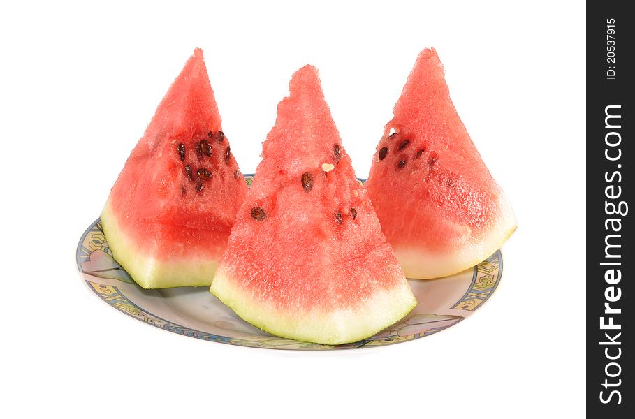 Three pieces of a water-melon lie on a plate
