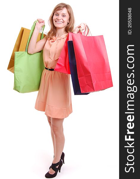 Young girl with shopping bags isolated on white