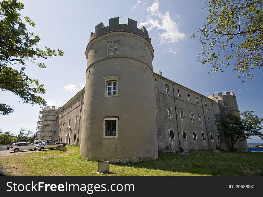 Exterior of the medival castle Zrinski-Frankopan with the tower and the blue sky. Exterior of the medival castle Zrinski-Frankopan with the tower and the blue sky