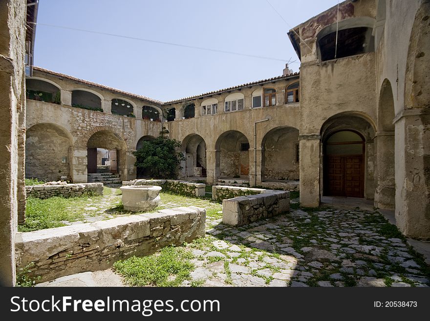 The fountain in the courtyard of the monastery, convent, in Kraljevica, with the balconies and arched. The fountain in the courtyard of the monastery, convent, in Kraljevica, with the balconies and arched