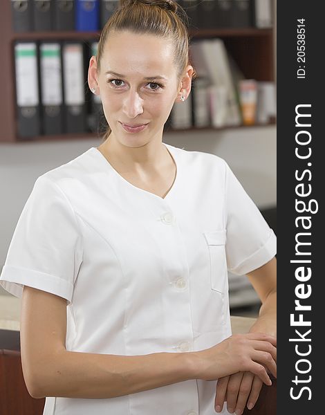 Nurse in the reception area of a medical office. Nurse in the reception area of a medical office