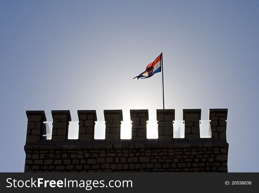 Tower of Frankopan castle in Novi Vindolski with the Croatian flag