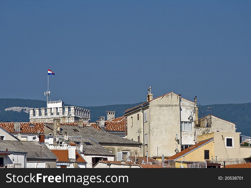 Panoramic view on the urban part of Novi Vinodolski with it`s roofs and buildings. Panoramic view on the urban part of Novi Vinodolski with it`s roofs and buildings