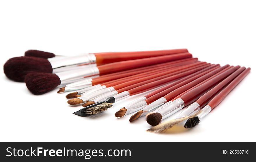 Makeup brushes on a white background