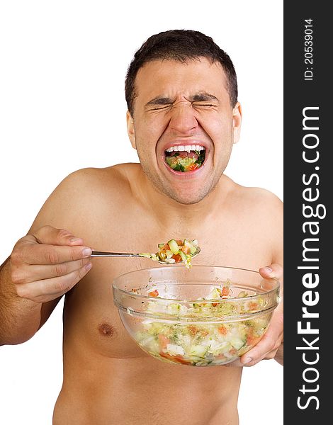 Young happy smiling man eating salad