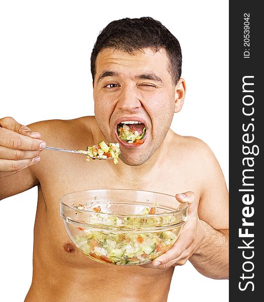 Man is eating a salad. Man is eating a salad