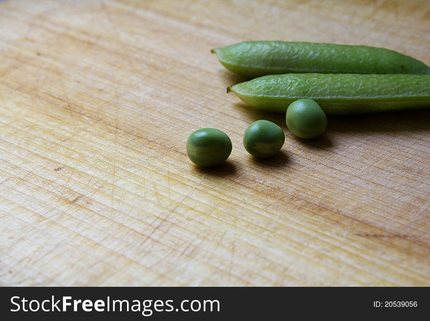 Peas on wooden deck