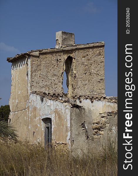 The shell of a ruined Spanish house