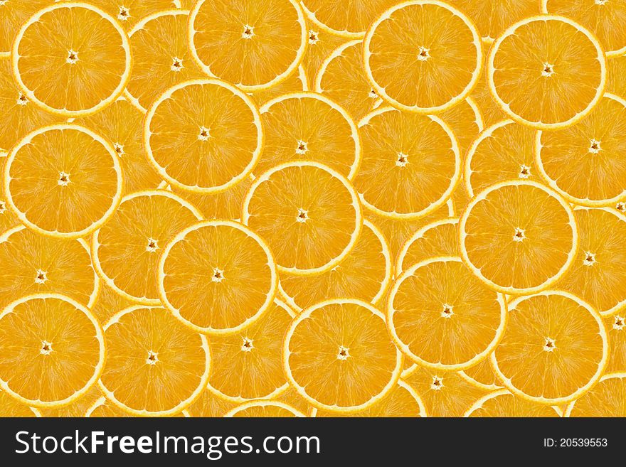 Orange background from slices of oranges