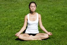 Yoga Woman On Green Grass Stock Photo