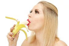 Candy Girl Sucking A Banana Royalty Free Stock Images