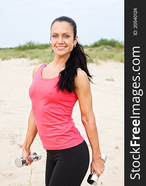 Woman during fitness on sea beach. Woman during fitness on sea beach