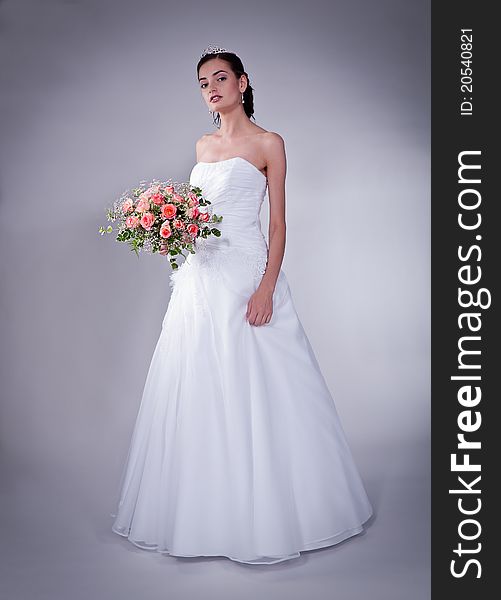 Women in wedding dress with flowers