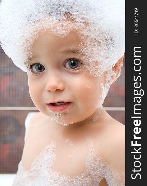 Little boy with foam on his head. Little boy with foam on his head