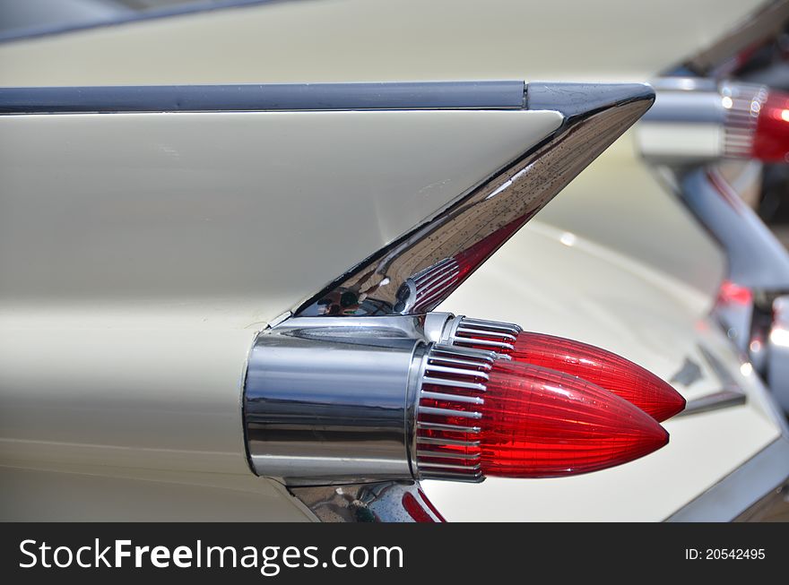 Tail lights on the fins of a classic 1950's automobile. Tail lights on the fins of a classic 1950's automobile