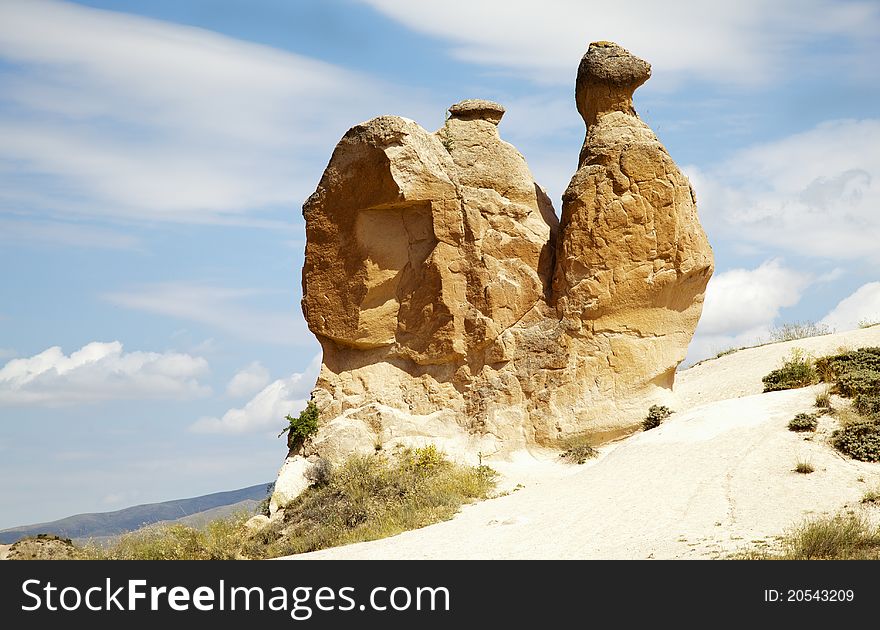 Dirt track leading to limestone boulders