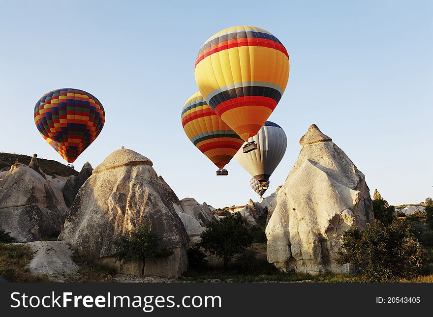 Early morning hot air balloons, limestone rock formation, natural minerals, weathered rosks, landscape, horizontal, copy space. Early morning hot air balloons, limestone rock formation, natural minerals, weathered rosks, landscape, horizontal, copy space