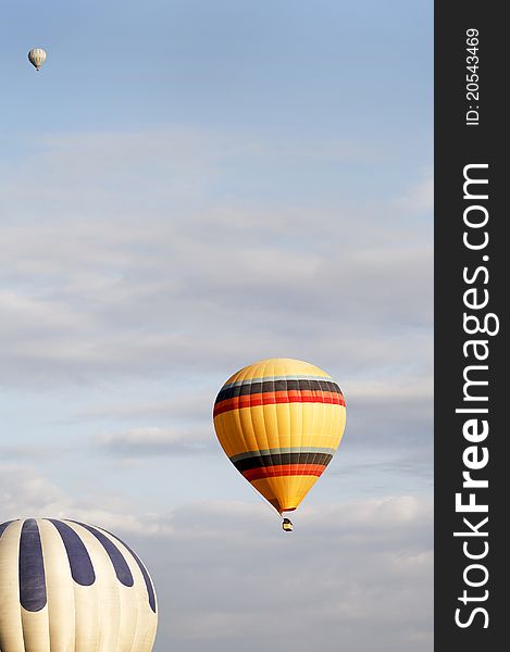 Three Balloons In A Cloudy Sky