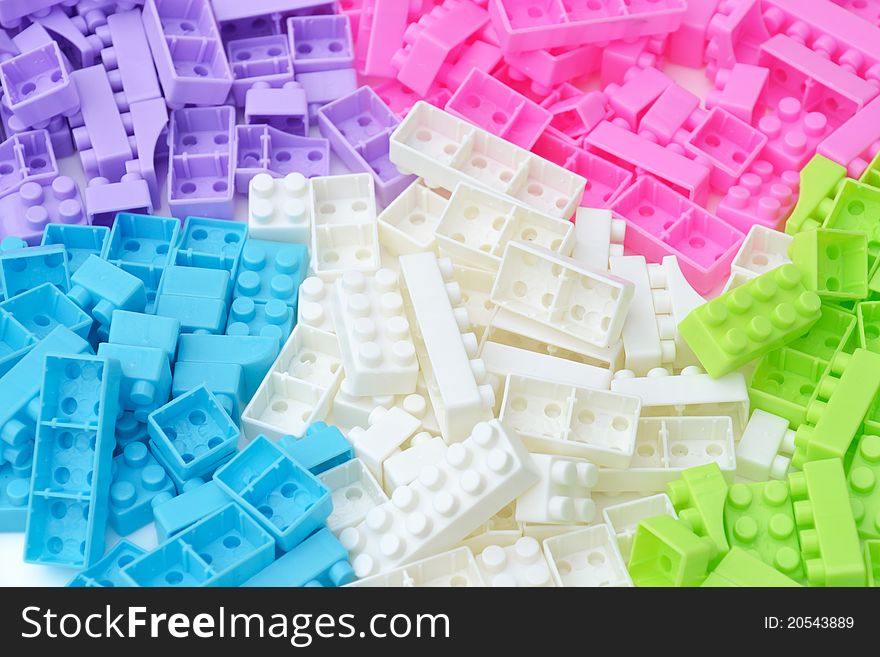 Group of color brick toy on white background.