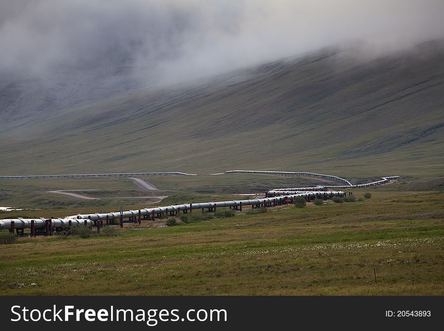 Tran-Alaska pipeline with fog near Dalton highway, Alaska