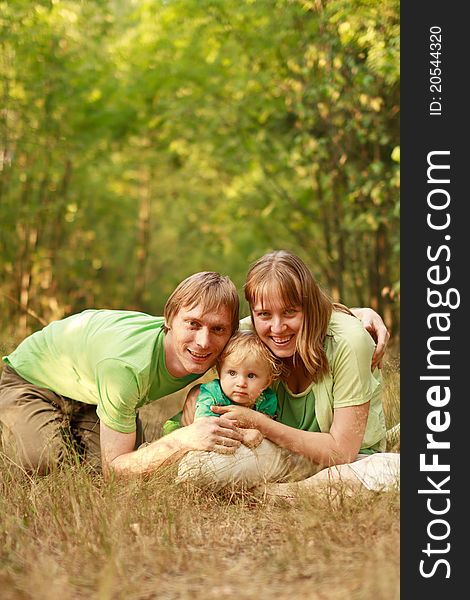 Loving young family in summer nature having fun together. Loving young family in summer nature having fun together