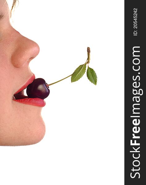 Young woman's mouth with cherry on white background. Young woman's mouth with cherry on white background