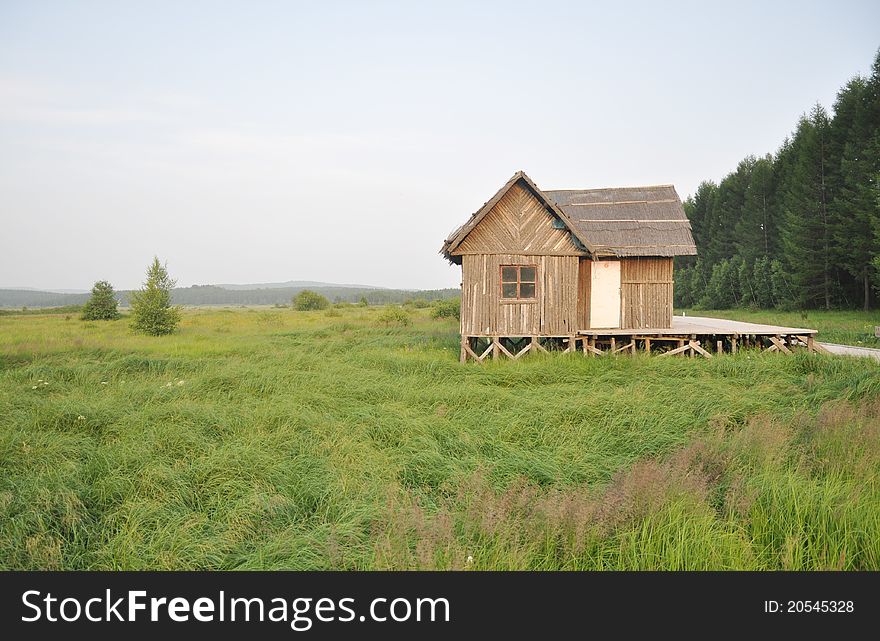 The wood holiday villa in the grassland by the woods.