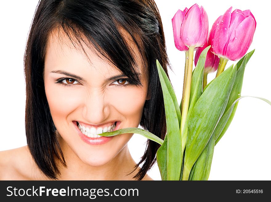 Portrait of female face biting tulip leaf, looking at camera. Portrait of female face biting tulip leaf, looking at camera