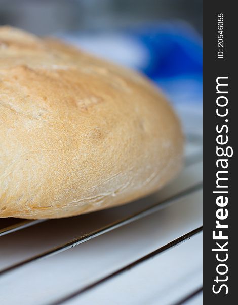 Homemade bread lying on the grate