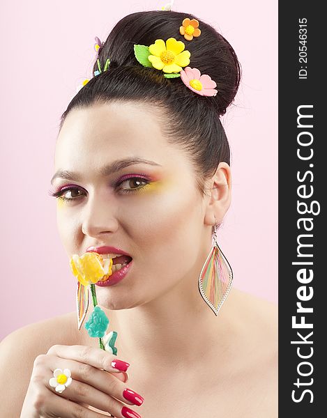 Close-up portrait of beautiful brunette with glamor make-up and color candy style