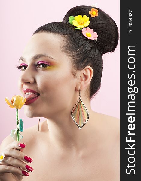 Close-up portrait of beautiful brunette with glamor make-up and color candy style