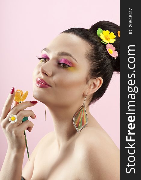 Close-up portrait of beautiful brunette with glamor make-up and color candy style