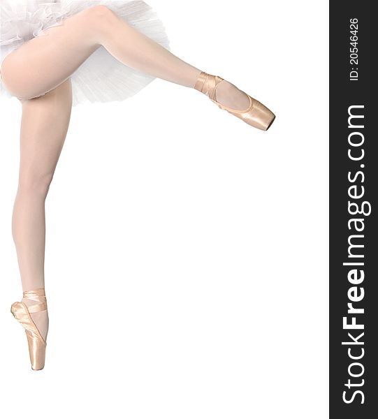 Legs of dancing ballerina on tip of toe isolated on white background