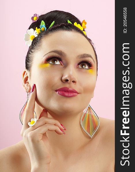 Close-up portrait of beautiful brunette with glamor make-up and color candy style