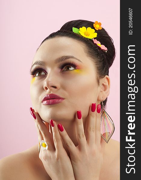 Close-up portrait of beautiful brunette with glamor make-up and color candy style