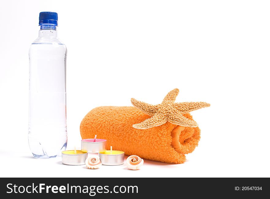Spa objects: towel, candles and starfish