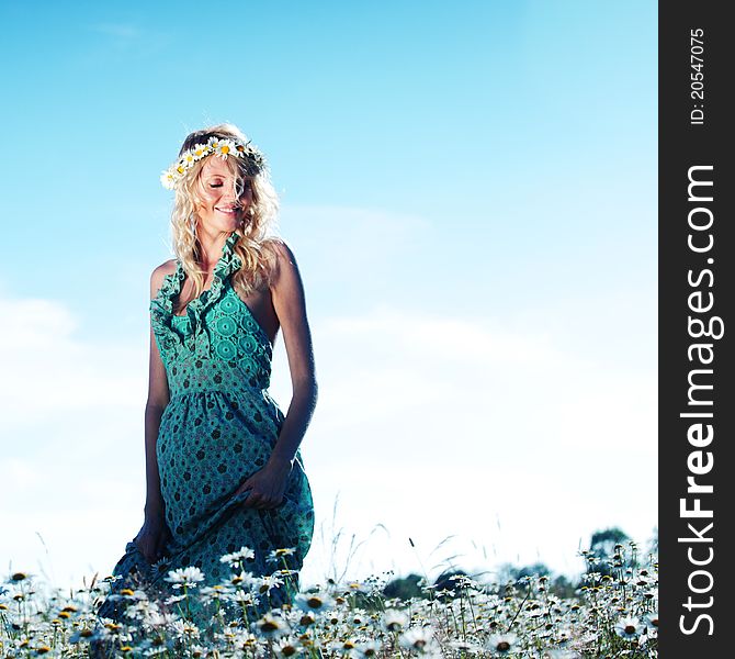 Girl In Dress On The Daisy Flowers Field