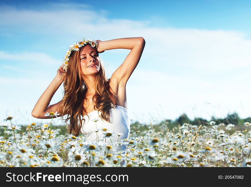 Girl In Dress On The Daisy Flowers Field