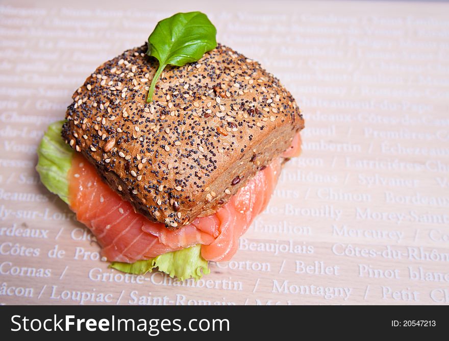 Sandwich, appetizer with smoked salmon and iceberg leaves. Sandwich, appetizer with smoked salmon and iceberg leaves