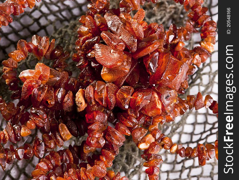 Amber necklace on interesting background.