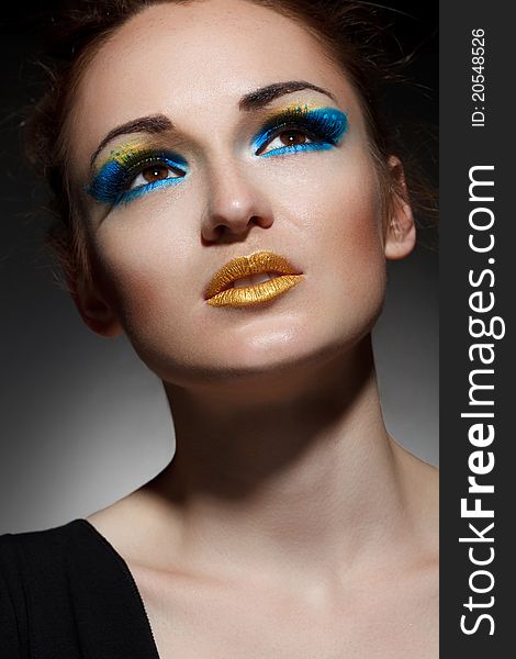 Beautiful young woman with bright make-up. Beautiful young woman with bright make-up