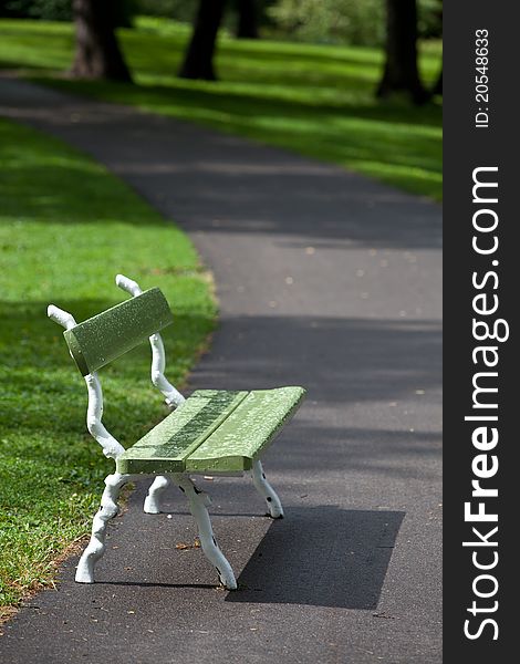 Green bench in the park after rain. Green bench in the park after rain.