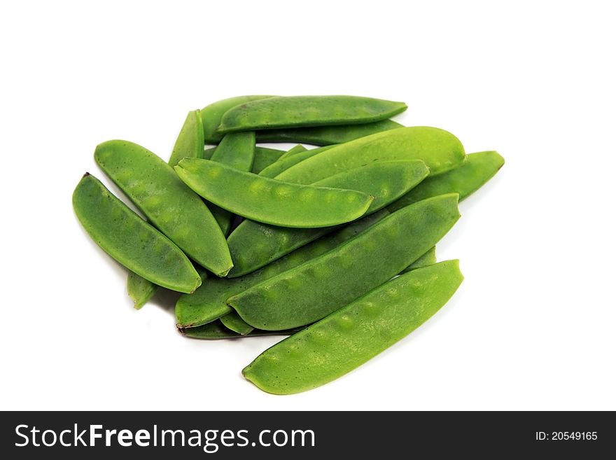 Many green pea pods on white background