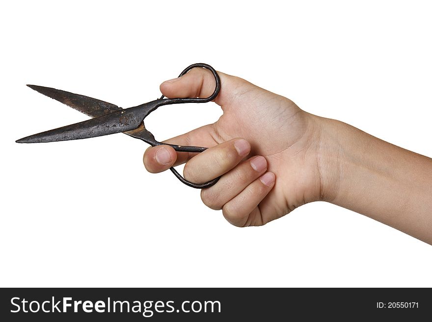 Old scissors in boy's hand.