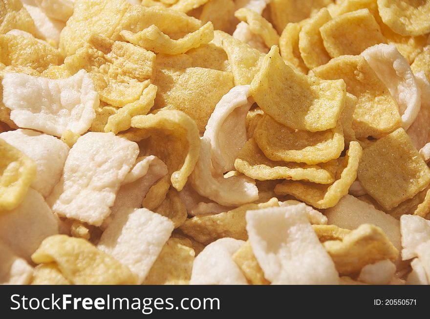 Full shot of fish crackers; food background